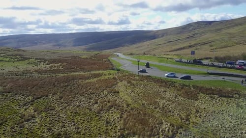 Aerial view of winding road through hills and mountains, United Kingdom.