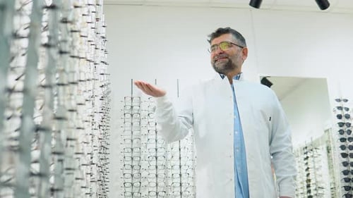 Senior Dotor Ophthalmologist in Glasses in Optical Store
