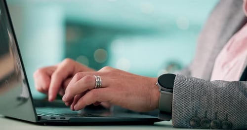 Close Up Hands Typing on Laptop Keyboard