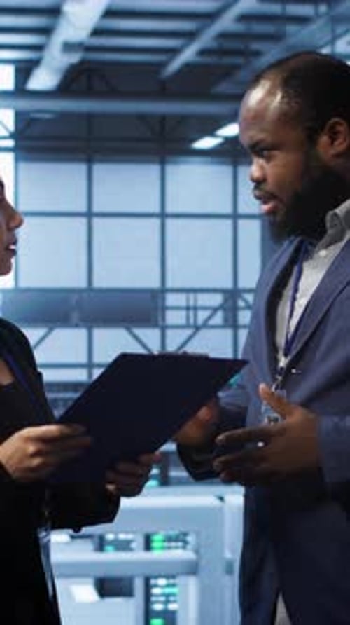 Vertical Video Team of Admin in Server Hub Checking Recovery Plan Monitoring Data Center