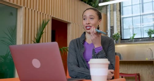 Young woman talking on Phone in Office