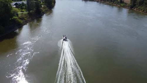 Speedboat Cruising On Cumberland River At Daytime In USA - aerial drone shot