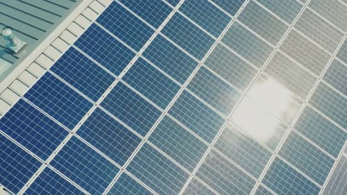 Drone Shot at the Solar Panels Installed on the Roof of the Building Aerial View