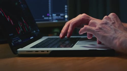 Businessman Hands Working on Laptop or Computer Keyboard for Trading or Stock Market Investing Male