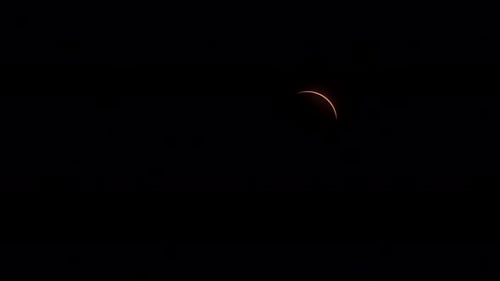 During a total solar eclipse, the thin outline of sunlight reappears.