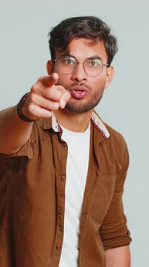 Happy Indian Smiling Man Pointing Finger to Camera Making Winner Choice Showing Direction Select