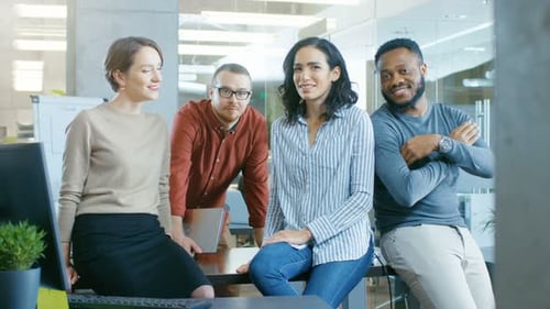 Office Colleagues Chatting While Sitting in Office