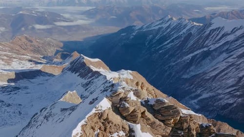 Drone Over Cross On Snowy Mountain Peak