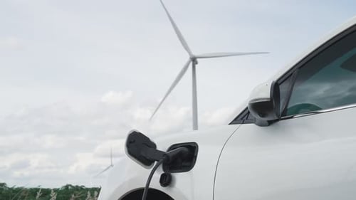 Progressive combination of EV car, charging station and wind turbine.