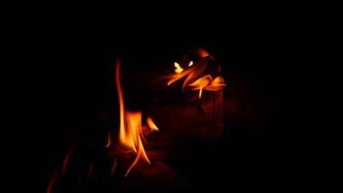 Dramatic Flames Burning Brightly in Dark Close Up