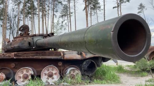 Burnt Russian tank near Irpen. Detail of iron on a rusted armored car