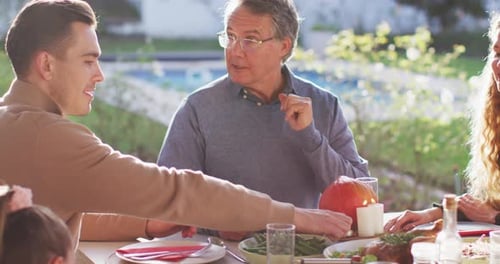 Family and Friends Gather Outside for Meal