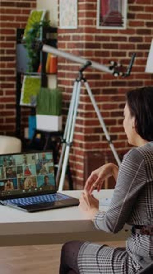 Woman Participating in Video Conference Call from Home