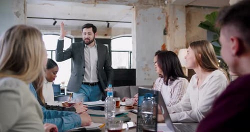 Happy Multiethnic Team of Professional Business People Put Hands Together and Clap at Loft Office