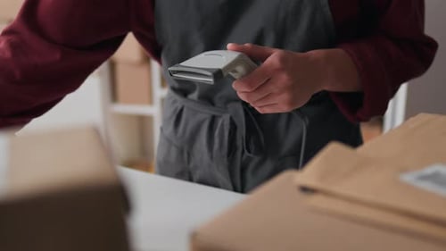 Woman Worker Scanning Process Of Inventory Of Goods In The Warehouse Of Packing And Sending Goods