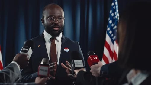 Politician Giving a Press Conference with American Flags