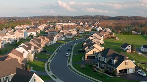 Aerial of large housing development in USA, bordering on farm and farmland in United States of Ameri