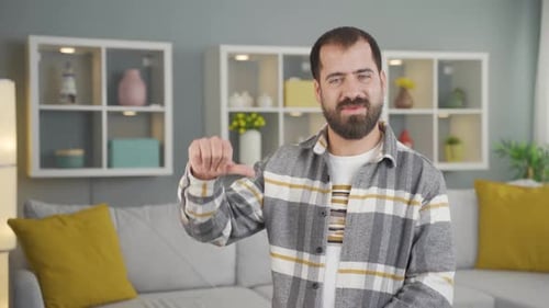 Man Gesturing with Hands Indoors