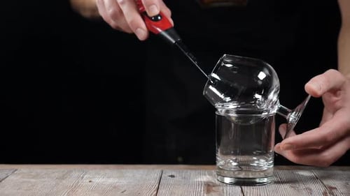 Bartender Lighting Drink With Fire Preparation