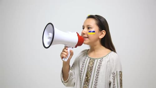 Girl Speaks into Megaphone with Ukrainian Flag on Face