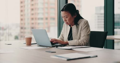 Business woman, laptop and documents in office for research, financial report and audit with typing