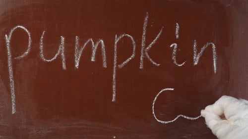 Drawing Jack-O-Lantern on Chalkboard