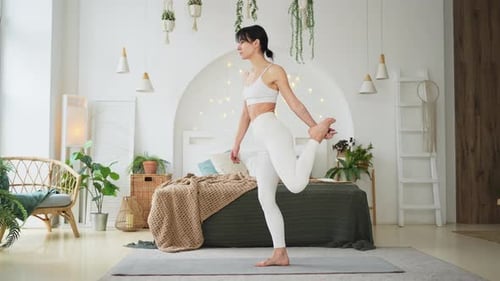 Fit Woman Doing Yoga Pose on Exercise Mat