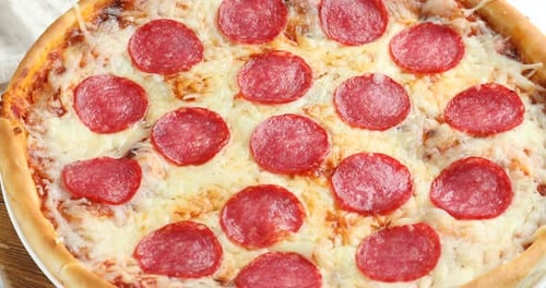 Delicious Pepperoni Pizza with Melted Cheese and Crust