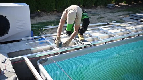 Construction Process of a Custom Swimming Pool in a Backyard During Summer 2023