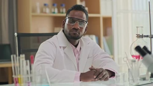 Scientist Looking at Camera in Laboratory Setting