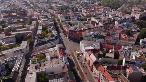 Aerial Views Capture the Berlin Skyline on a Bright Day Highlighting Landmarks and Vibrant Green