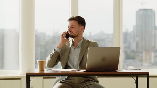 Young Man Businessman Working in an Office Happy Man Speaking with Phone to Someone He End Talking