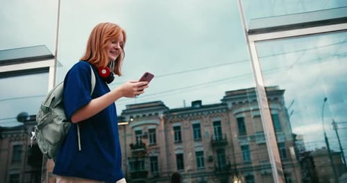 Beautiful Young Woman Student with Coffee and Phone Outdoors College Student Walking in University