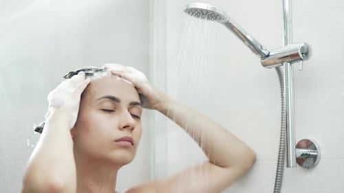 Woman Washing Hair in Shower Close Up
