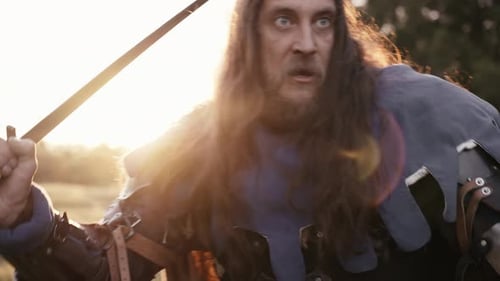 Brave Medieval Warrior with a Sword Goes Into Battle