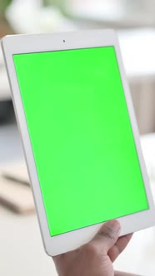 Businessman Watching Tablet with Green Chroma Key Screen, Vertical Video