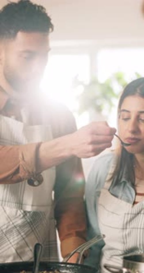 Affectionate Couple Cooking Together in the Kitchen