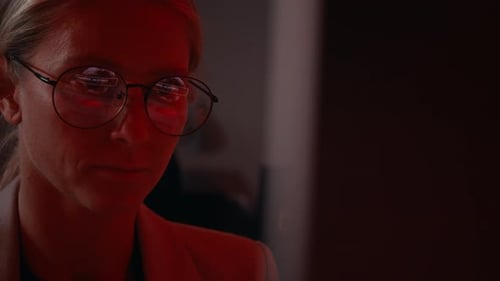 Woman with Glasses Looking at Computer Screen