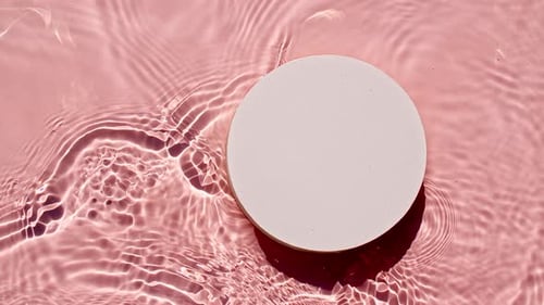 Empty White Circle Podium on Transparent Clear Water Texture with Waves in Sunlight