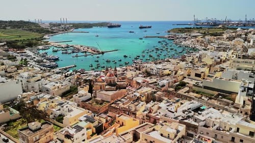 Aerial view of Malta showcasing vibrant harbor and coastal landscape