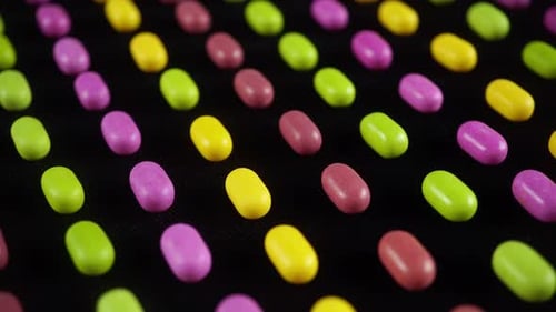 Vibrant Candies Displayed on Black Surface