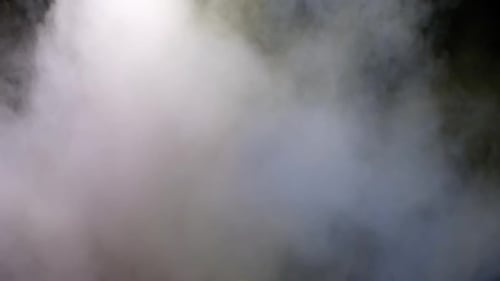 Collider Collection: Multicolored powder lingering on a black background
