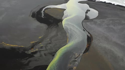 Aerial view of a river along the coast in Iceland.