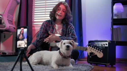 Young Adult Sings and Plays Electric Guitar