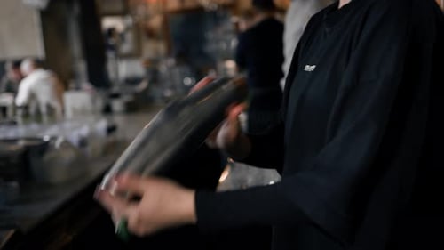 Close-up - the process of preparing a cocktail in a restaurant using a shaker
