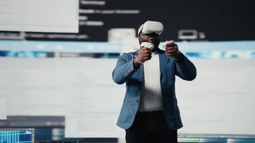 African American Software Developer Uses Virtual Reality Headset for Coding