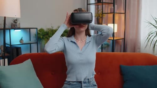 Woman Using Virtual Reality Headset on Couch