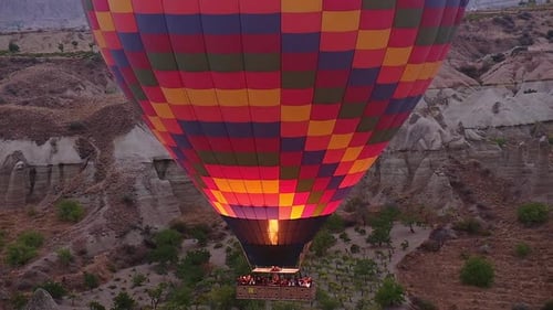 Colorful Hot Air Ballooning Over a Cappadocian Landscape