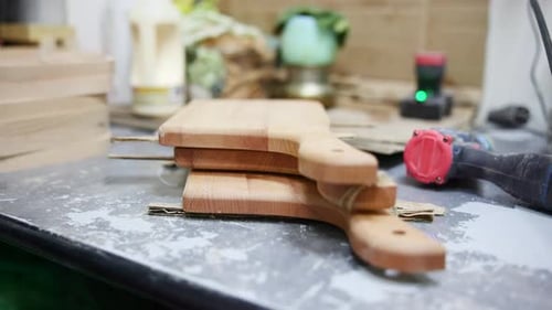 Workshop Crafting Scene Wooden Cutting Surfaces Displayed Amidst Workshop Preparation Activities