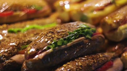 Individually wrapped assorted gourmet submarine sandwiches for takeout
